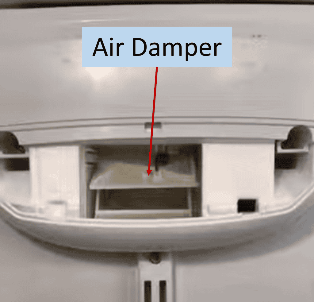 Refrigerator air damper shown in partially open position