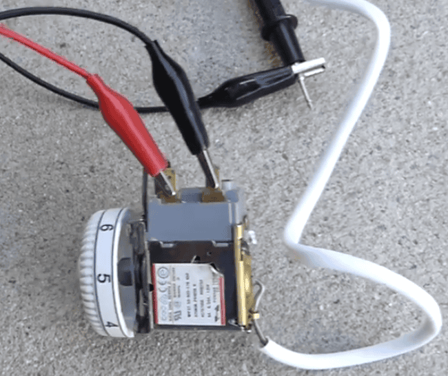 Testing a refrigerator thermostat with a multimeter