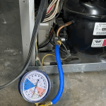 Refrigerator refrigerant pressure test with gauge