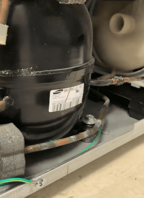 Samsung refrigerator compressor shown while running